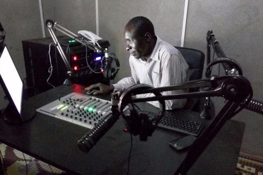 A sound engineer at a studio console