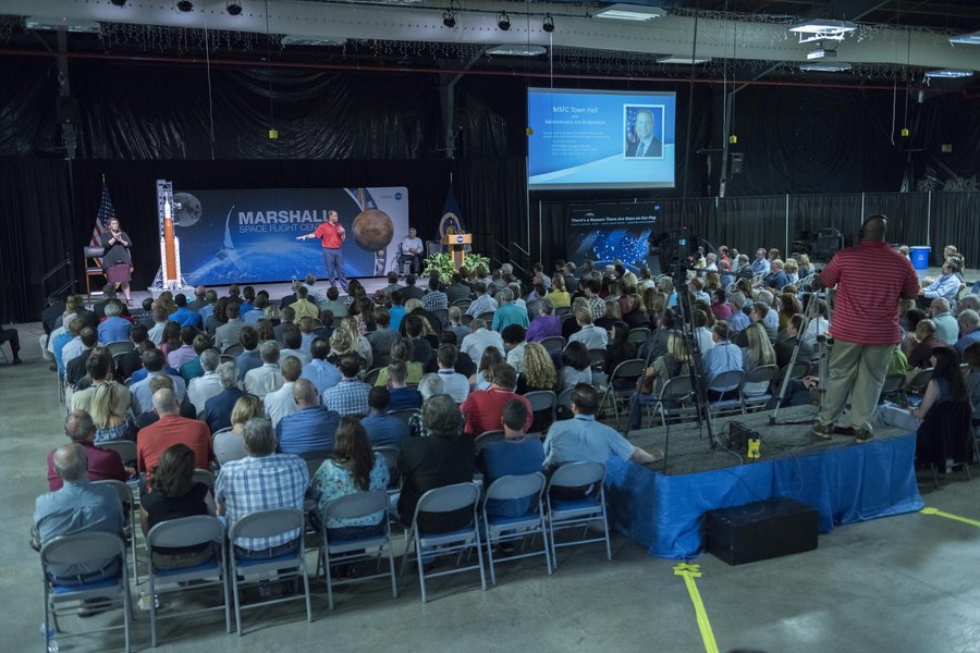 A large audience in a hall during a company event
